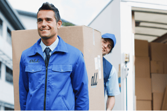 a man in a blue jacket and tie dyes a tie