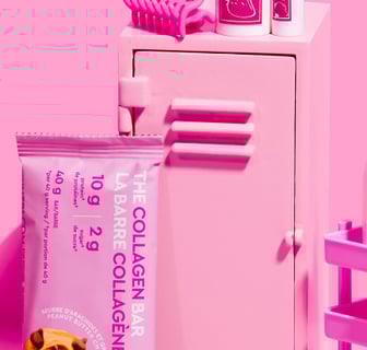 fitness locker with fitness accessories and peanut butter collagen bar on pink background