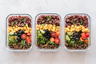 Three containers of food that include rice, beans, and veggies made after learning how to meal prep