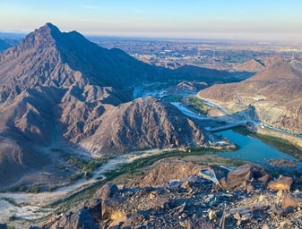 a mountain view of a river and mountains