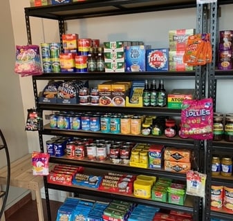 a shelf of food and snacks on a shelf