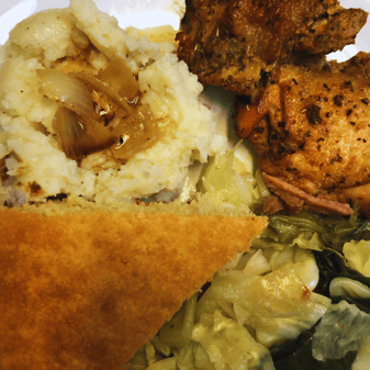 baked chicken and mashed potatoes and cabbage dinner