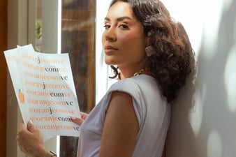 a woman in a white shirt and black pants