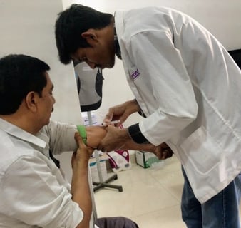 a nurse taking a patient's blood