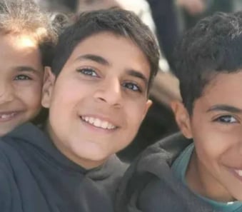 a group of young children posing for a picture