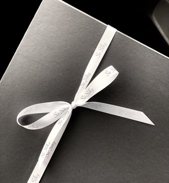 minimal gift packaging white ribbon