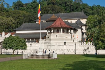 a large white building with a flag on it