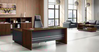 Executive office interior from the Kate Series showcasing a classic wood and charcoal desk, high-bac