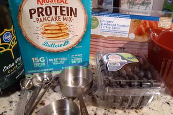 protein pancakes w bueberries and bacon