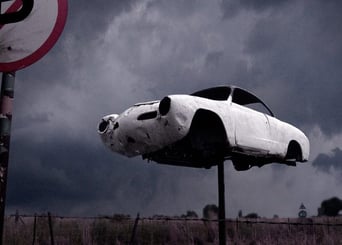 Abandoned fine art photography print from Martin Osner’s iconic collection featuring a vintage car mounted on a pole
