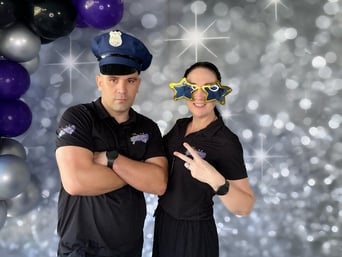 Carly and Kahn from SweetAz Co. posing in the photo booth for Daune's 60th Birthday Party Brisbane.