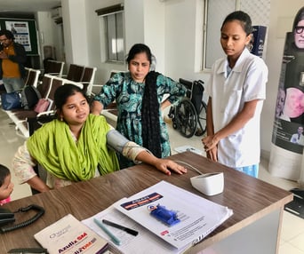nurse checking patient BP