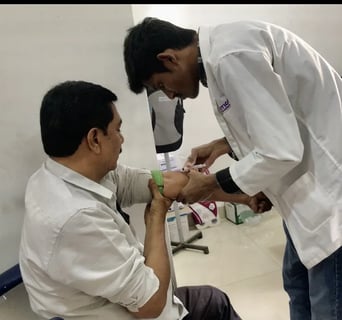 Lab Assistant Is Taking Blood Tests From Patient In Madinaguda Branch.