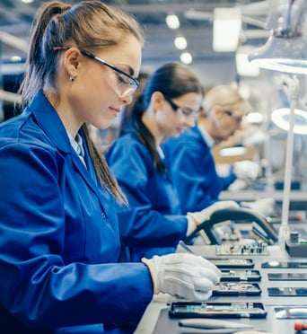 Female worker in assembly line