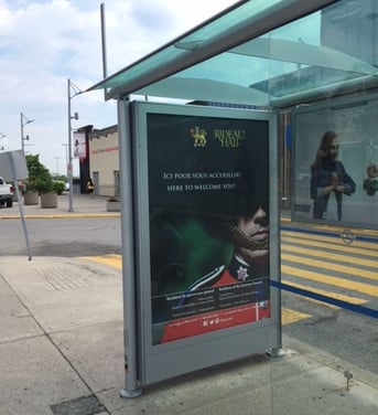 poster displayed in a bus shelter