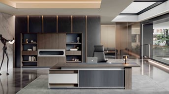 Modern executive office from the Pino Series featuring a stylish desk with vertical paneling, a leat