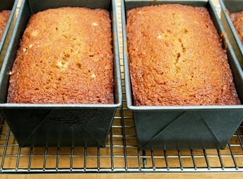 Loaves of pawpaw quick bread cooling on a rack
