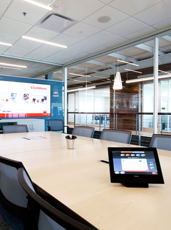 Image of a conference room with control touch panel