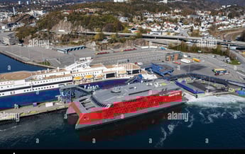 a large ship in the water with a large ship in the background
