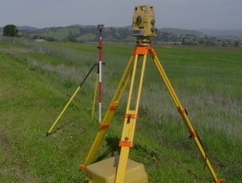 a tripod with a camera and a tripod