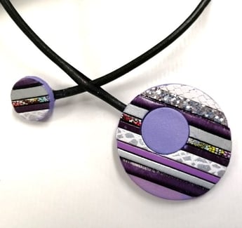 a necklace with a purple and silver necklace