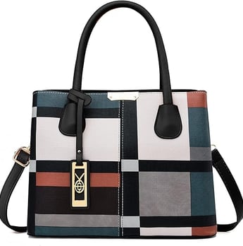 a woman's handbag with a colorful plaid pattern