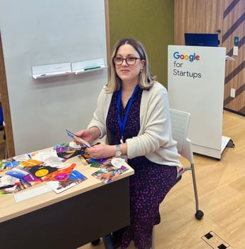 Julie Gachet Mitrovic sitting at a table with Strengths cards for a workshop at Google for Startups