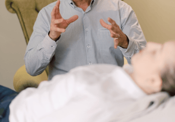 Hypnotherapist guiding client in session for anxiety and trauma healing