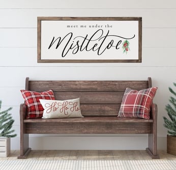 meet me under the mistletoe sign