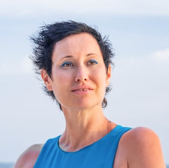 health coach with a blue dress and smile