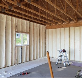 spray foam insulation inside of a house in lakewood, colorado