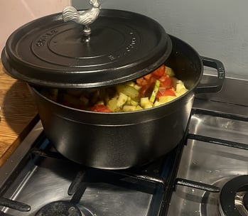 a potted potted with vegetables on a stove top