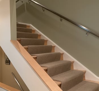 modern staircase with metal railing
