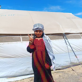 little Palestinian  girl with victory sign