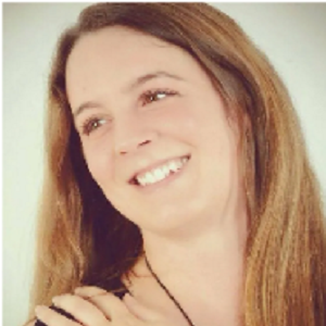 a woman with long hair and a necklace