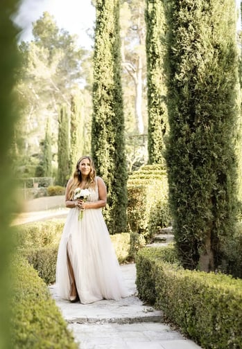 Bride walking down the aisle of a French garden for her Provence elopement ceremony