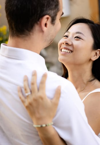 Provence engagement photographer — woman gazing into her partner’s eyes while embracing