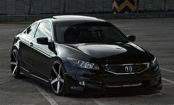 Black Honda Accord, lowered with aftermarket rims and jet black window tint