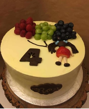 a cake with a bunch of fruit on it