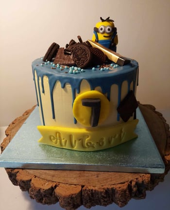 a cake with a minion on top of it