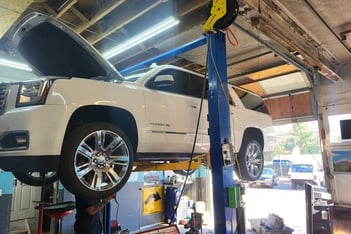 a white truck is parked in a garage