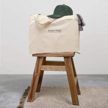 a baggy bag with a hat on top of a stool