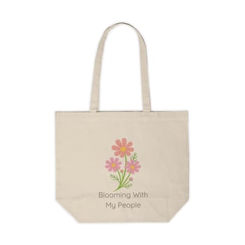 a tote bag with a flower blooming in the middle