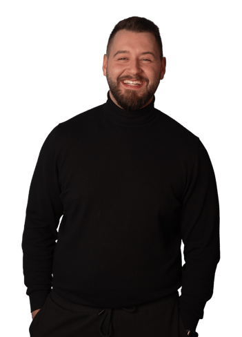 a man with a beard and a beard, smiling