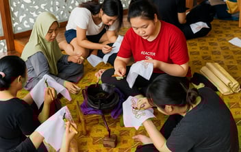 a group of people sitting on the floor
