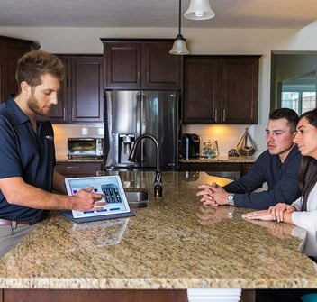 Premier Water sales consultant presenting water system to homeowners