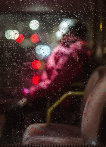 An abstract of a person seated in public transport, created by Josh K Jackson.