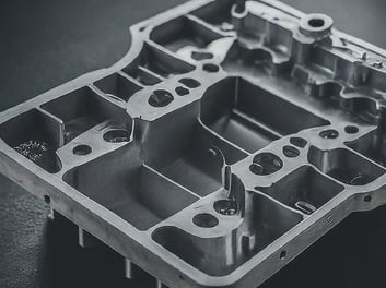 a metal box with a metal structure and a black and white photo
