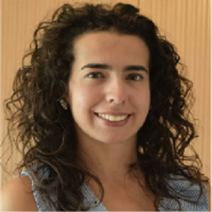 a woman with curly hair and a blue dress