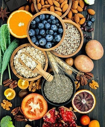 a variety of fruits and vegetables in bowls